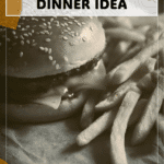 A spider hamburger with fries styled as a festive Halloween family dinner meal. 2